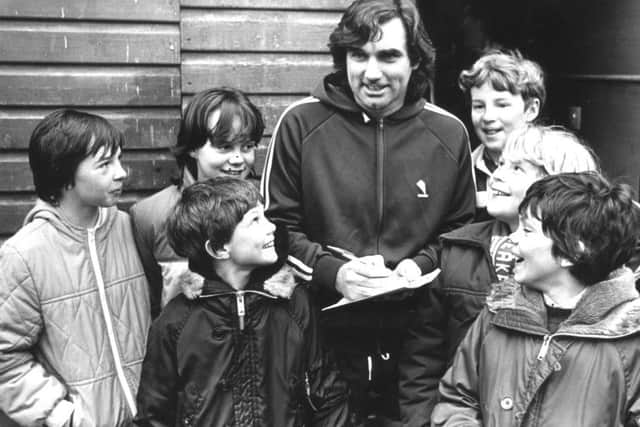 George Best signing autographs for fans at the Lytham fundraiser