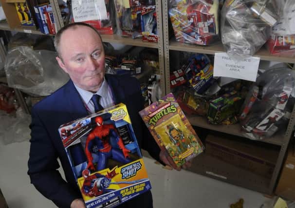 Tim Coglan, service manager of Public Protection at Blackpool Council with some of the counterfeit toys recovered