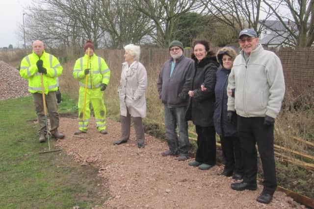 Members of the Friends of Blackpool Road North Playing Fields, St Annes, with workmen at the Health Path being constructed at the playing fields thanks to £12,000 from the Tesco Bags of Help scheme