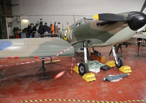 Blackpool and The Fylde College students refurbishing a full scale Spitfire replica at the aviation museum at Blackpool Airport