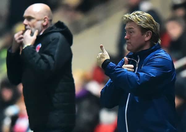 Uwe Rosler and Stuart McCall had different emotions at full-time