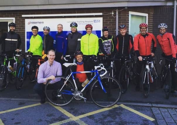Reach your peak in 2017 with Ste, front right, and his Alps

cyclists, shown here being welcomed to specialist regional cancer treatment

centre, the Rosemere Cancer Centre, Preston, by Rosemere Cancer

Foundations head of fundraising Dan Hill, front left