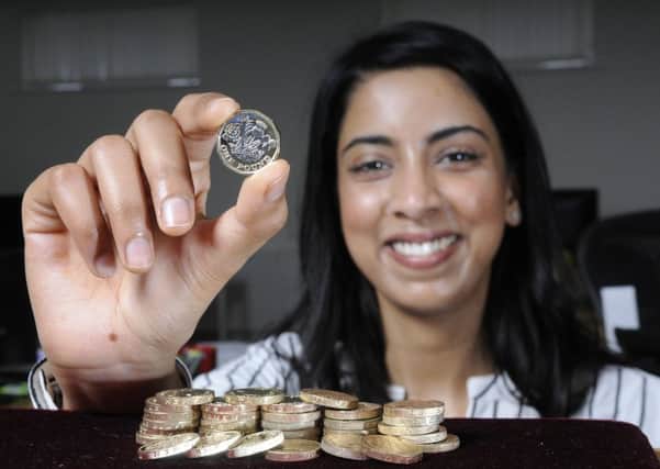 Bhumika Sharma from Chard with the new pound coin