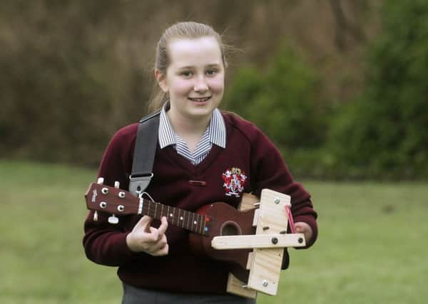 11-year-old St Aidan's pupil Helena Pye has had a ukulele specially adapted for her to play by her music teacher Phil  Dalton