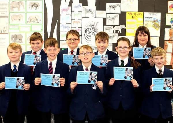 The Year 7 studentsat Carr Hill High School have  raised Â£2,000 for an animal charity with their postcard designs