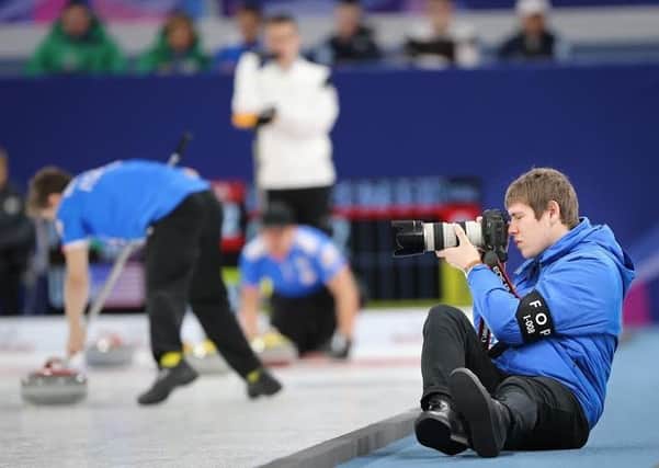 Second year photography student Tom Rowland in action on his dream placement at the World Junior Curling Championships in South Korea. Photo : WCF/Richard Gray