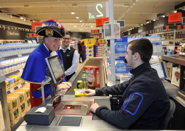 Town Crier Michael Middleton, Manager Steve Hatch and Joe Tattersall at the opening of the new Lidl in Poulton