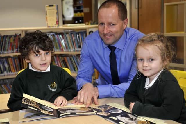 Ben Spence, five and Lily Callaby, five with headteacher Anthony Goth in the new Weeton Primary School building on Weeton Barracks
