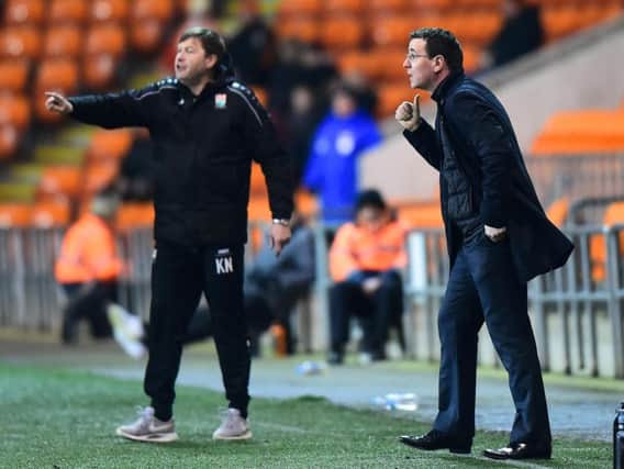 Barnet boss Kevin Nugent on the touchline with Gary Bowyer