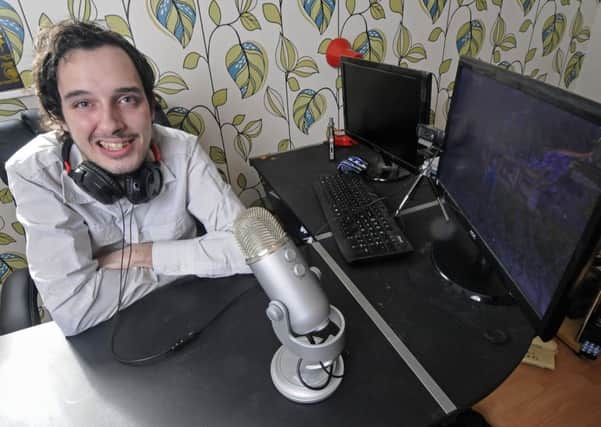 Garron Holliday at his gaming computer preparing for his world record bid