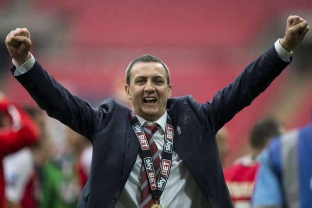 Fleetwood Town chairman Andy Pilley celebrates victory after Town's League Two play-off final win