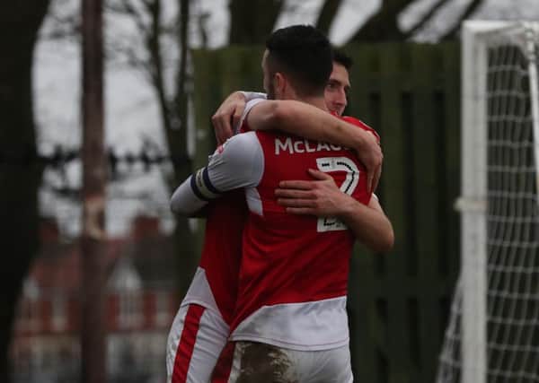 Bobby Grant and Conor McLaughlin celebrate the formers goal