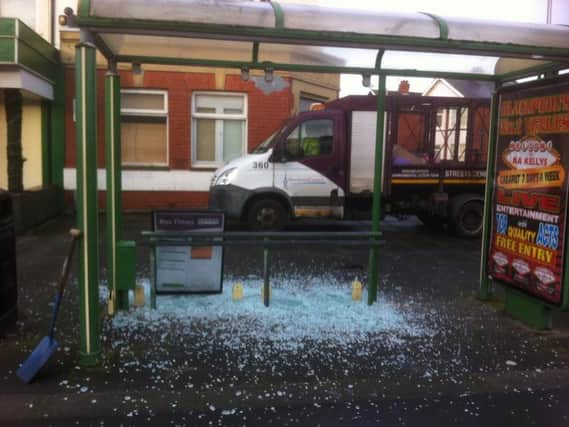 Shattered glass following a night of vandalism in Lytham Road