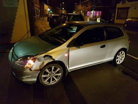 A police car was rammed as police tried to stop a suspected stolen vehicle