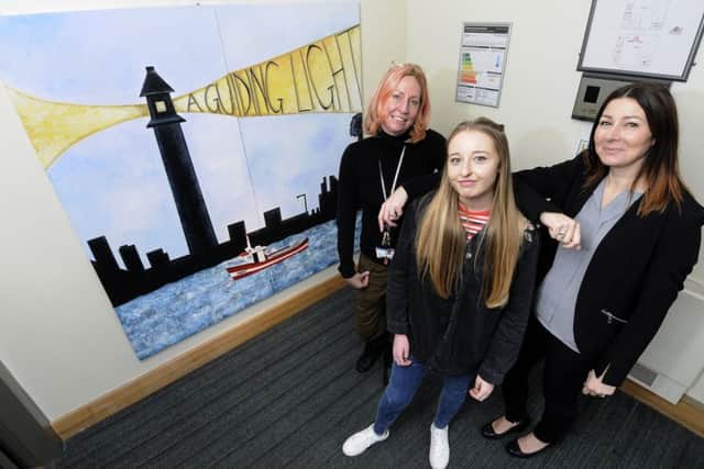 Artwork created by Blackpool and the Fylde College students has been installed at the Fleetwood Job Centre.  Pictured are tutor Jules Burton and Joanne Brownsword from the college with Janina Weeks from the Job Centre.
