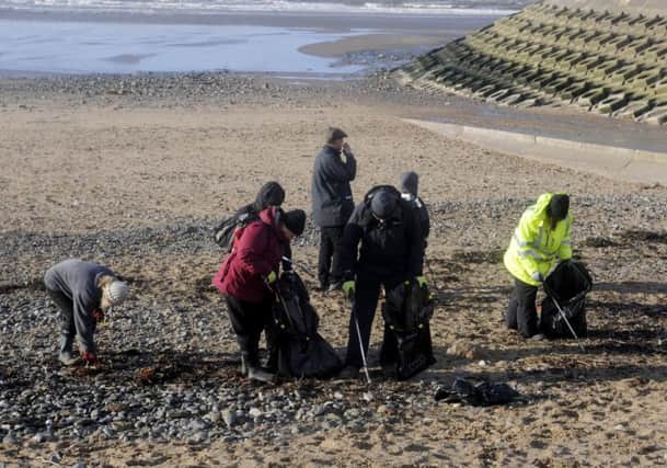 Surfers Against Sewage and local residents take part in a beach clean-up in Blackpool