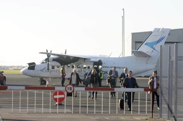 Passengers from a Citywing aircraft at Blackpool Airport