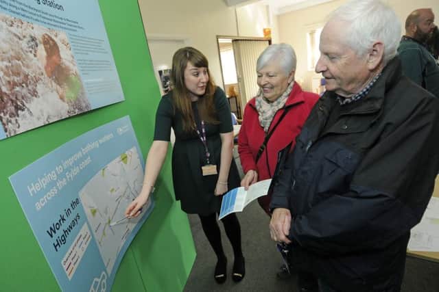 United Utilities exhibition at Asygarth Community Centre.  Sarah Allen from United Utilities talks to local residents Christine Willder and Robin Willder.