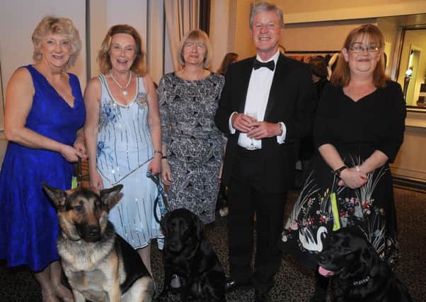 Sue Ballantyne, Barbara Clarkson, Marj Boyer, Andy Guiel and Cheryl Johnson, with guide dogs Bamber, Fliss and Thelma