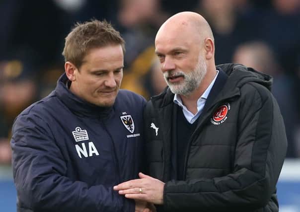 Fleetwood Town head coach Uwe Rosler with Neal Ardley, his AFC Wimbledon counterpart