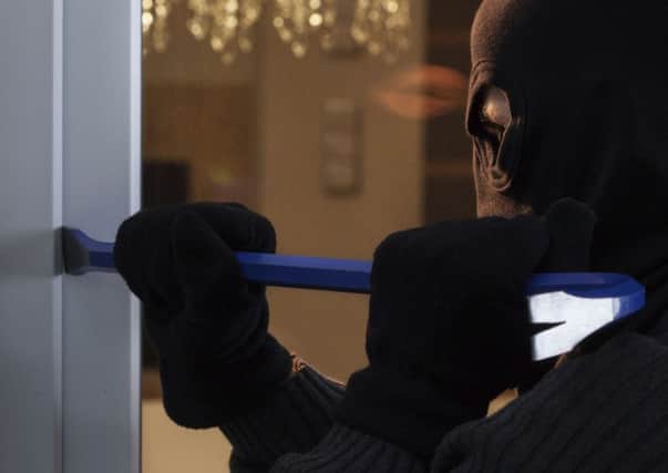 A Generic Photo of burglar attempting to gain entry to a house. See PA Feature TOPICAL Burglary. PA Photo/thinkstockphotos. .