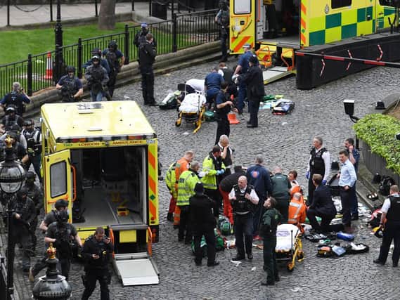 A car crashed into railings on Westminster Bridge before an attacker attempted to gain access to Parliament
