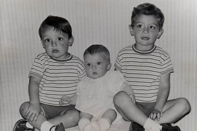 Iain, far right, with his brothers l-r Peter and James.