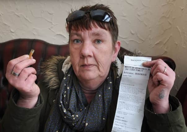 Georgina Hewlitt- Leigh with her discarded cigarette end and her penalty notice after she was collared in Birley Street