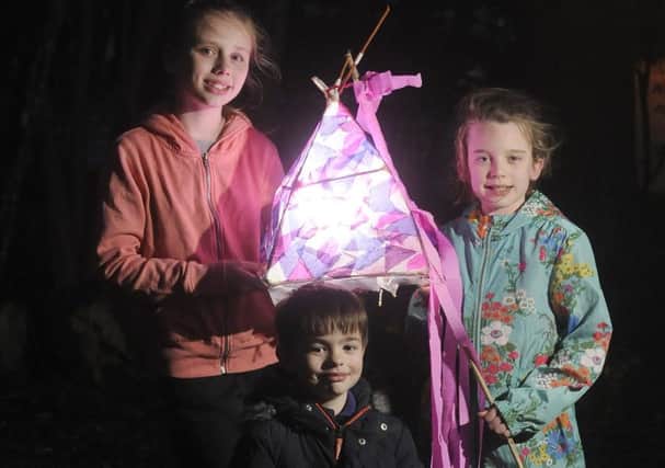Lantern festival at Blackpool Carer's Centre.  Pictured are Jessica Hesketh and Courtney Hesketh with Ruben Lear.