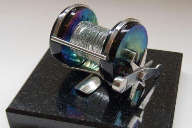 The glass fishing reel which will house his ashes