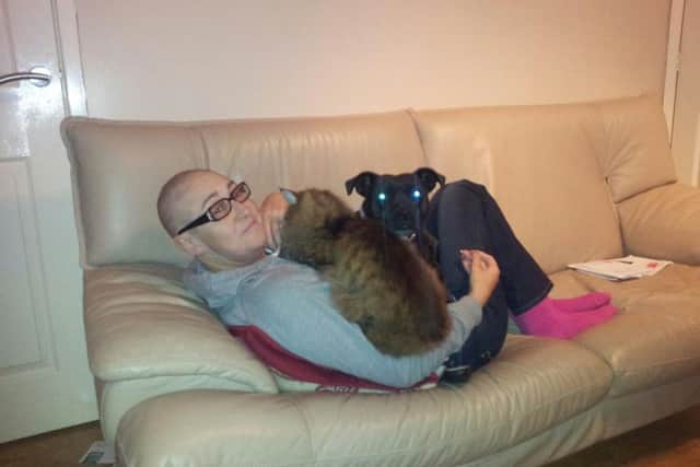 Lesley Ronson, who benefited from blood donation while battling Non-Hodgkin's Lymphoma. 
Lesley wih her dogs while she was having chemotherapy
