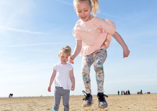 Poppy Turner  6yrs and sister Dasy 2 yrs from Manchester , Play on St Annes Beach Lancs