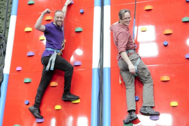 Reporter Tim Gavell tries the new Clip 'n Climb attraction with owner Dan Whiston