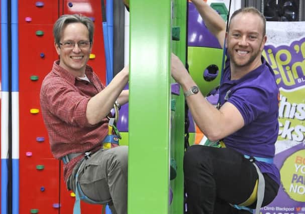 Reporter Tim Gavell tries the new Clip 'n Climb attraction with owner Dan Whiston