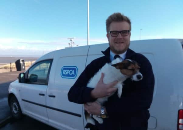 RSPCA inspector Carl Larsson with Bea the jack russell