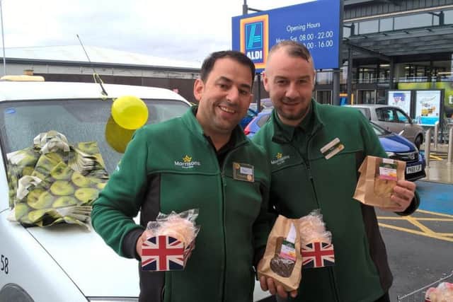Sam Smith (left) and Paul McCabe at the Morrison's stall outside the new Aldi which has opened on the retail park off Squires Gate Lane