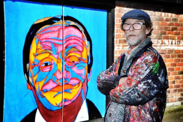 Artist Andy Austin with his striking outdoor portrait of comedian Les Dawson in St Annes
