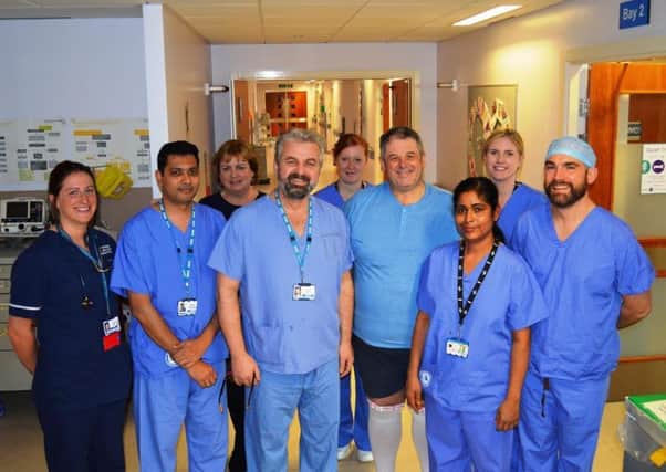 Douglas Coutts (fourth from right) with some of the team members at the Lancashire Cardiac Centre and Mr Nidal Bittar (fourth from left)