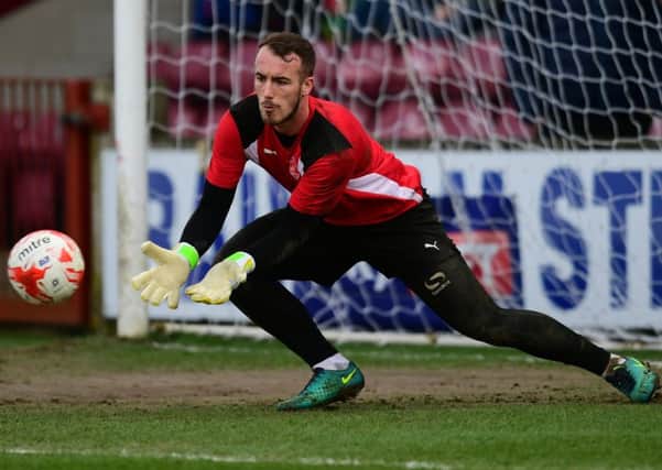 Fleetwood Town keeper Alex Cairns has been shortlisted for the Player of the Month award for March
