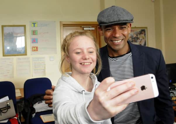Trevor Sinclair gives a talk and certificates to youngsters on the Inspiring Young People programme.  14-year-old Megan Henson gets a selfie with Trevor.