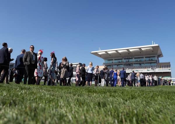 Racegoers arrive for Grand National Day