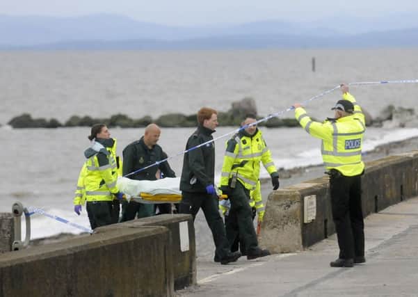 A body is recovered by emergency services from Rossall Beach