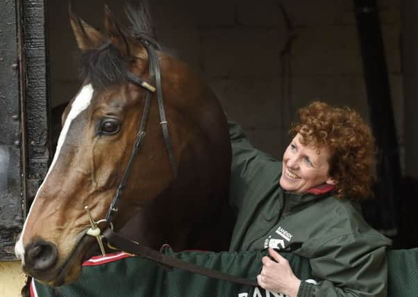 Grand National winner One For Arthur pictured with Lucinda Russell at her yard in Kinross, Scotland.
