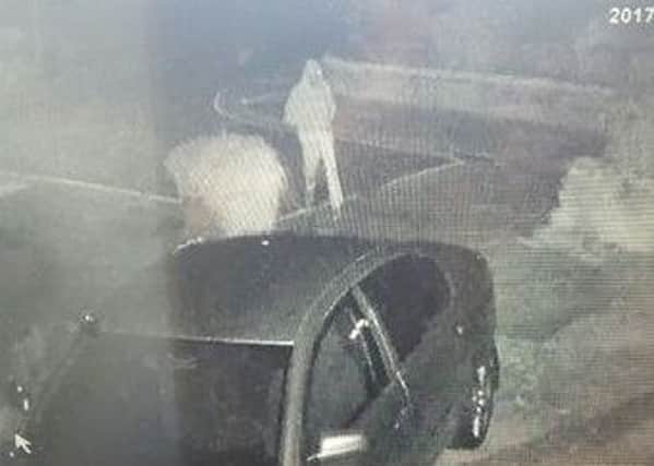 A man was caught on camera throwing a brick at a car windscreen, police said (Pic: Lancashire Police)