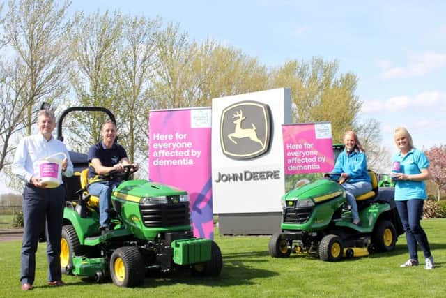 John Deere turf division manager Chris Meacock, Andy and Kathryn Maxfield, and Sue Swire of Alzheimers Society