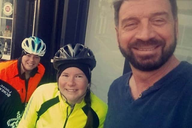 Kimberly and Lucy Downs with TV presenter Nick Knowles who they bumped into during their charity cycle ride from Staines to Staining