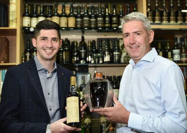Harrison and Wayne Ormerod of Whisky Online Auctions with their record breaking bottles of whisky.