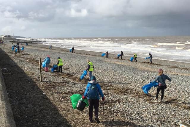 Dozens of  volunteers braved grey skies and a bracing sea breeze to clean up a popular Fylde coast beach.