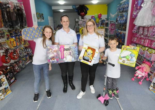 Sisters Laura Clark and Samantha Clark have opened Toys Plus on Topping Street.  They are pictured with 10-year-old Chanel Ince and 6-year-old Kai Ince.