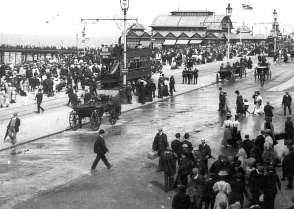 Flags flew above North Pier as the heavily-clothed crowds thronged on either side of Blackpool promenade in this turn of the century view. Landaus and trams dominated and not a car - or a traffic light in sight! It's also hard to find a single person not wearing some kind of headgear.
Blackpool historical / 1905/06